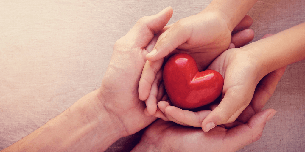 parent and child holding heart