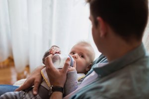 Father feeding baby