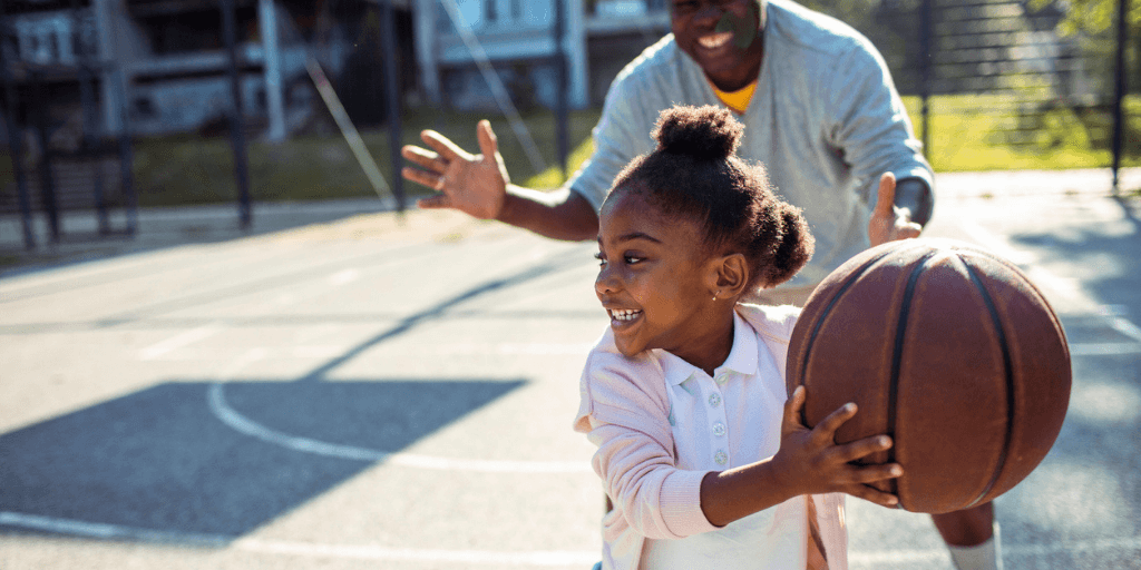 child playing basketball with grandfather