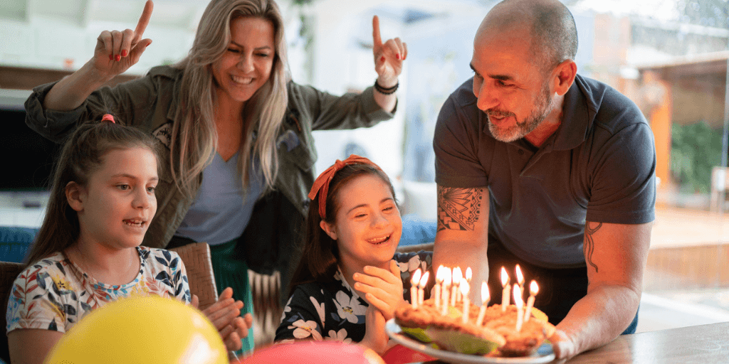 family celebrating birthday of special needs daughter