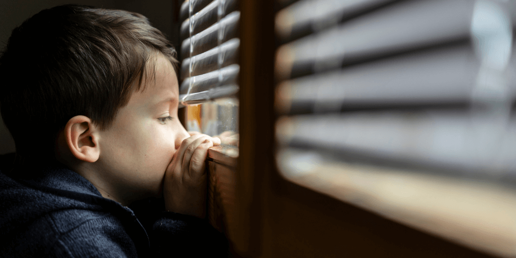 little boy looking out the window