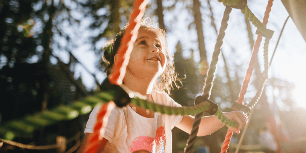 Child looking up at a playground