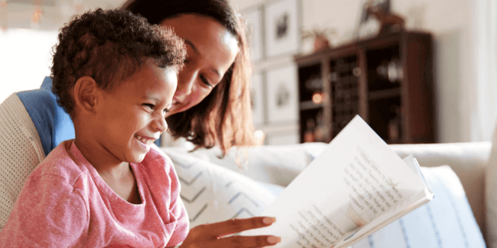 child reading with guardian